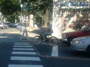 this bicyclist rode through a stop sign, past a right-turning car, rude and dangerous